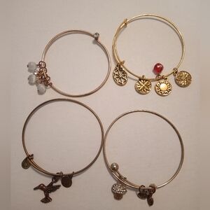 #422.    4 Piece Gold Toned Charm Bracelet Bundle
